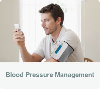 Blood Pressure Management - A man is wearing the FORA TN'G BP and measuring his blood pressure.