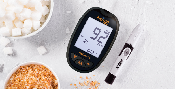 FORA Test N'GO Advance Multi-Functional Monitoring System and a lancing device on the table