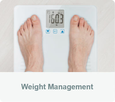 Weight Management - A person standing on the FORA TN’G Scale 550 to measure their weight.