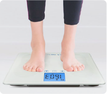 People standing on the FORA scale to measure weight