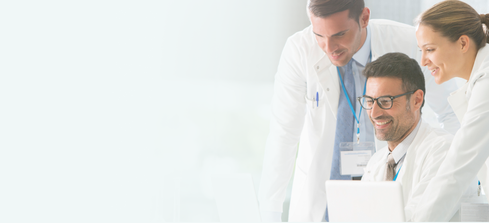 Physicians looking at computer screen