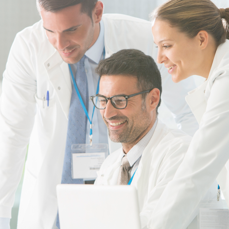 Physicians looking at computer screen