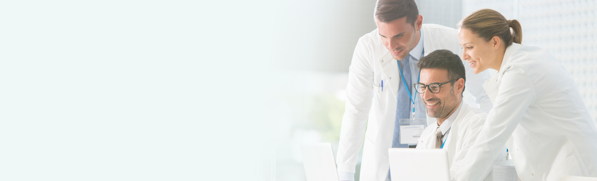 Physicians looking at computer screen